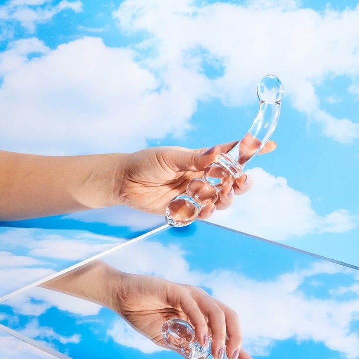Model holding Gem dual-ended dildo