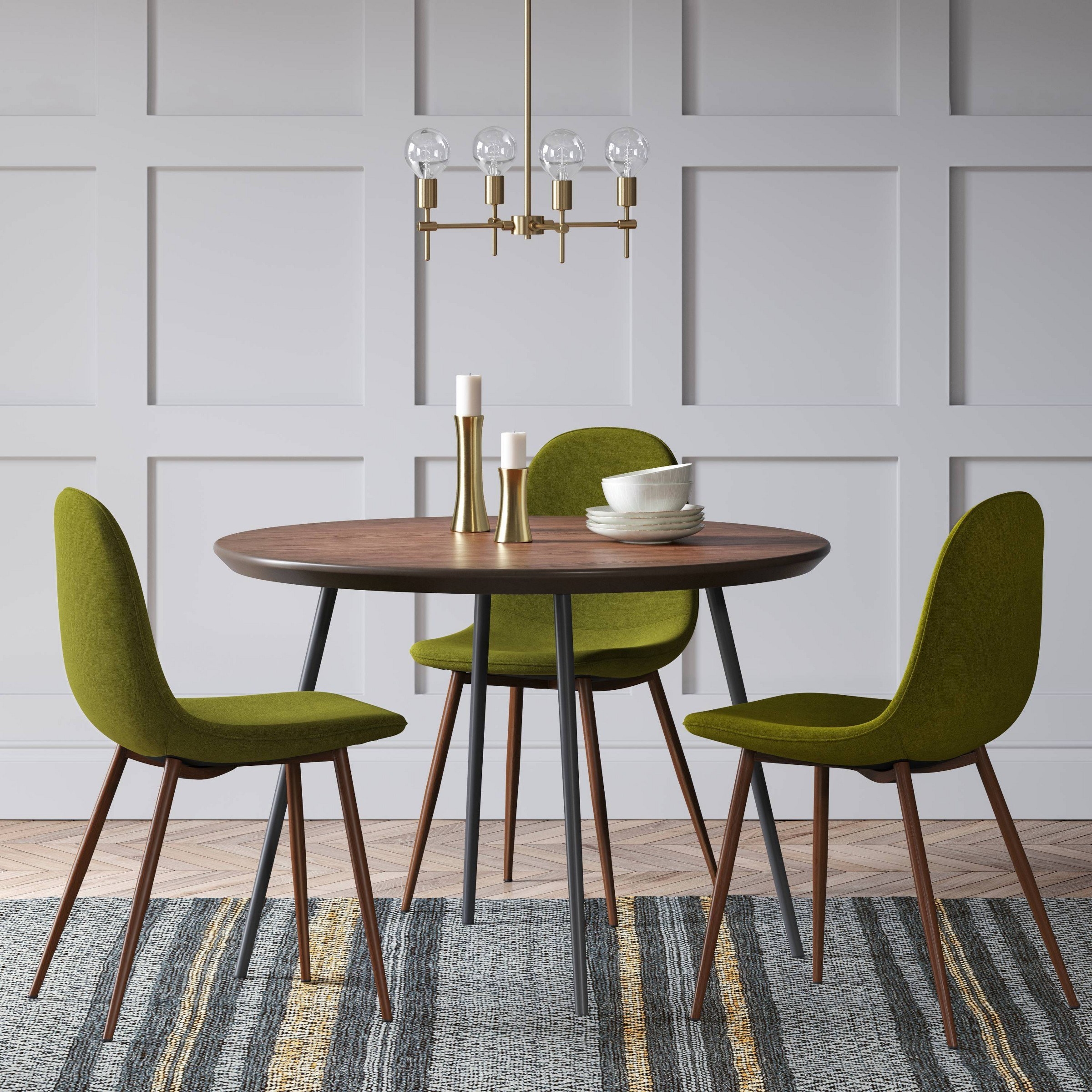three of the dining chairs in green around a wooden table