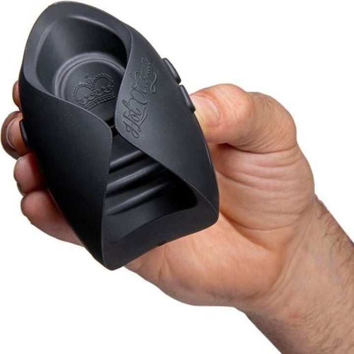 Model holding black vibrating stroker
