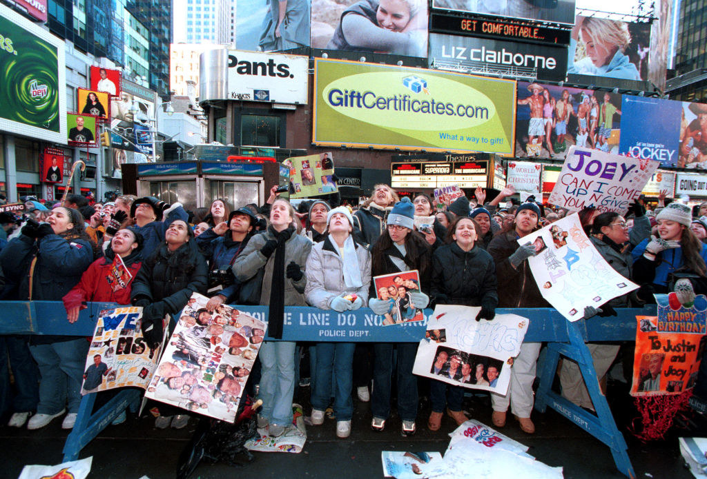fans stand outside the trl studios
