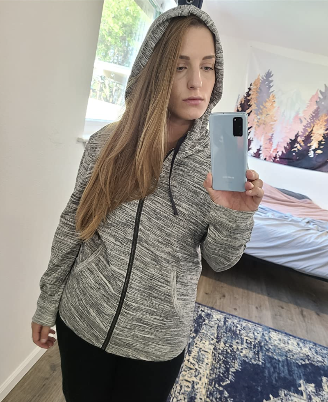 Reviewer wearing the ebony French terry zip hoodie