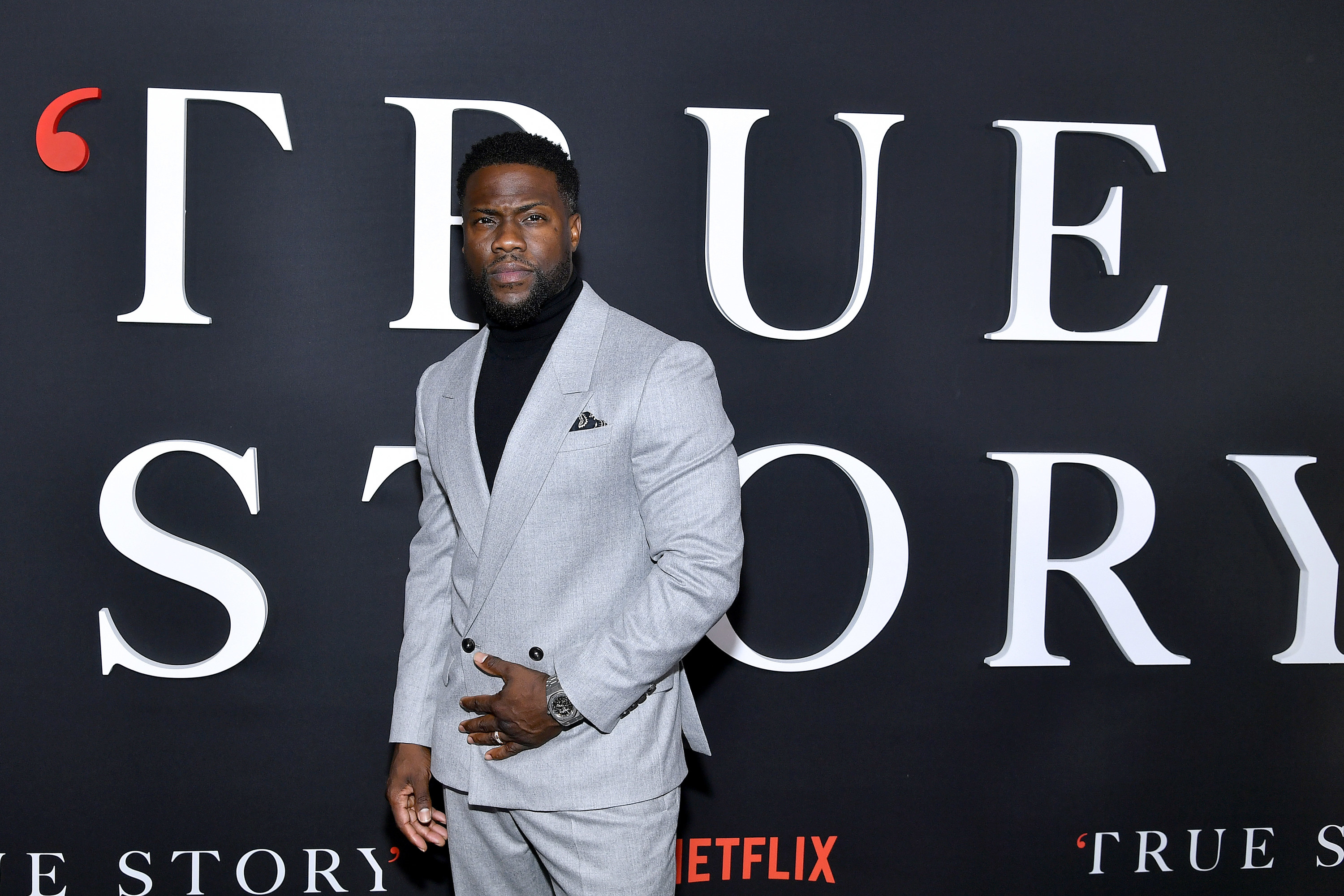 Kevin Hart poses on the red carpet at the True Story premiere
