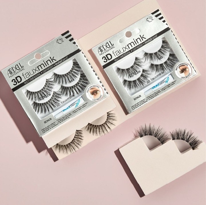 the fake eyelashes pack on a pink background