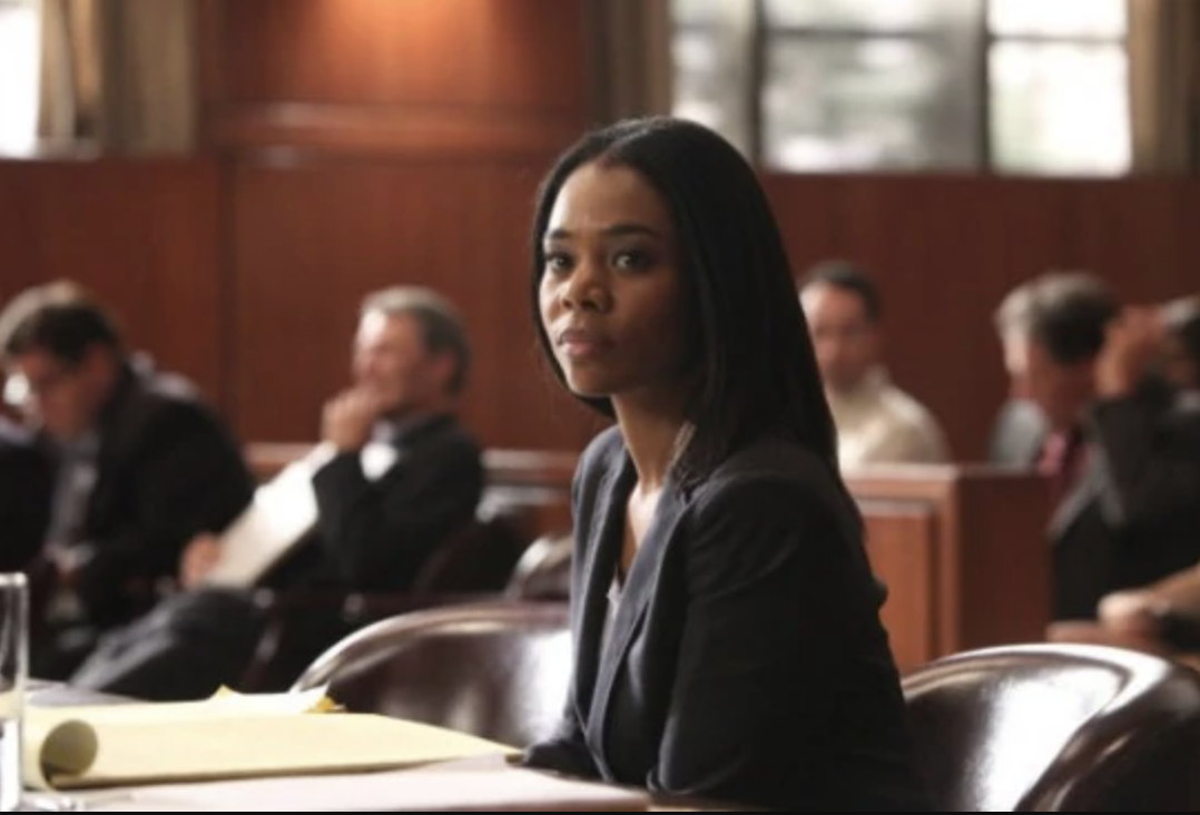 Regina Hall sits in a courtroom