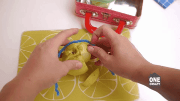 Blogger&#x27;s gif showing how to wrap a pipe cleaner around an apple to prevent it from browning