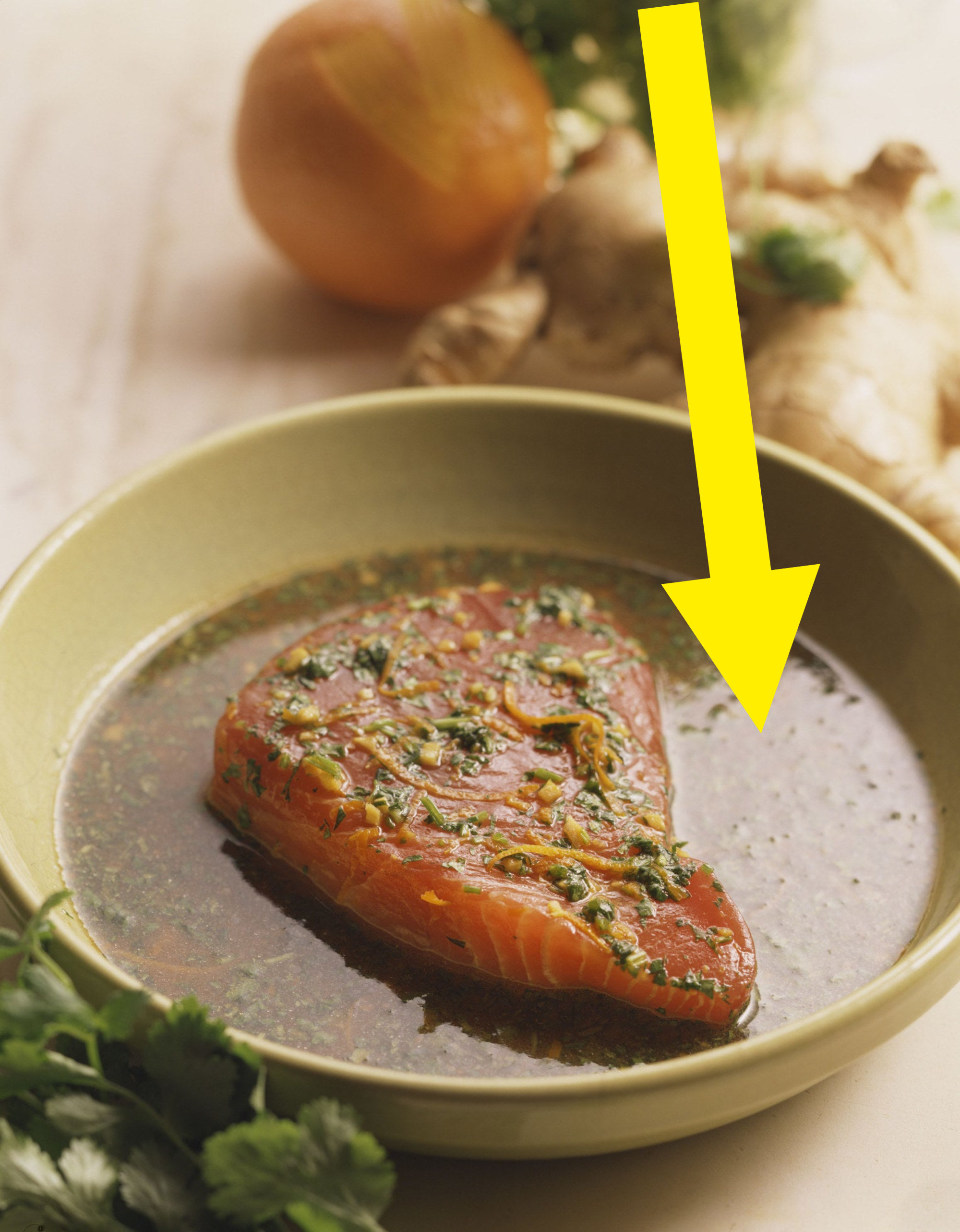 A piece of salmon marinating