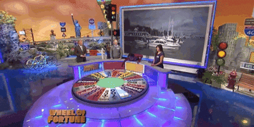 contestant spinning the wheel of fortune