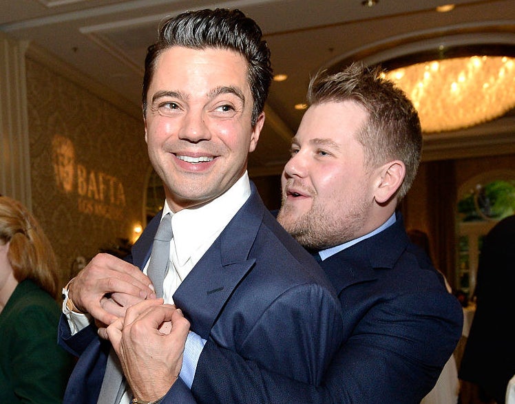 Old friends Dominic Cooper and James Corden being cheeky at the BAFTAs