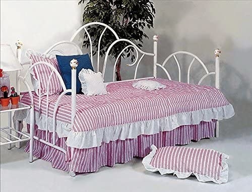 Striped Laura Ashley bedding on a metal-framed bed