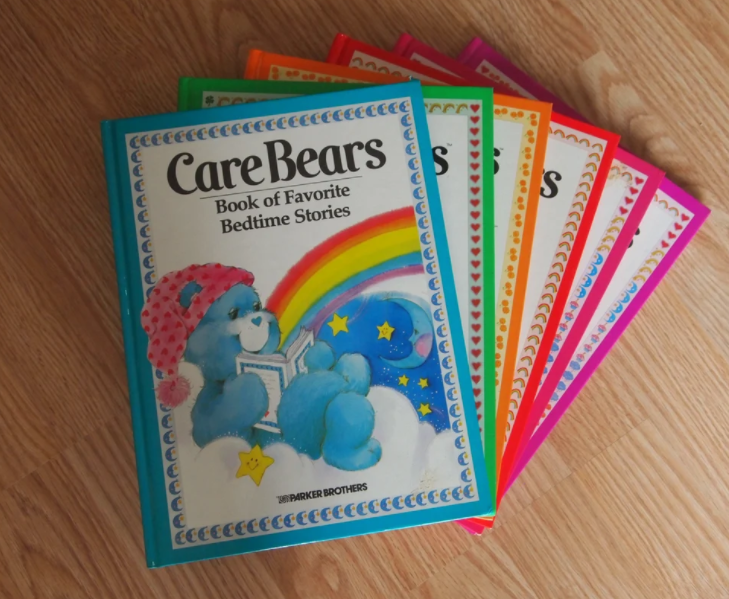 Five Care Bears books fanned out