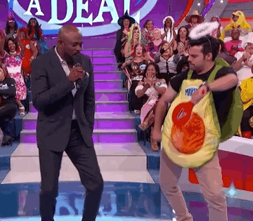 Wayne Brady dancing with a contestant on &quot;Let&#x27;s Make A Deal&quot;