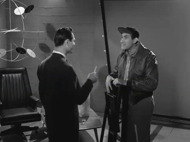 A man speaks with a technician who has just completed specialized underground bunker