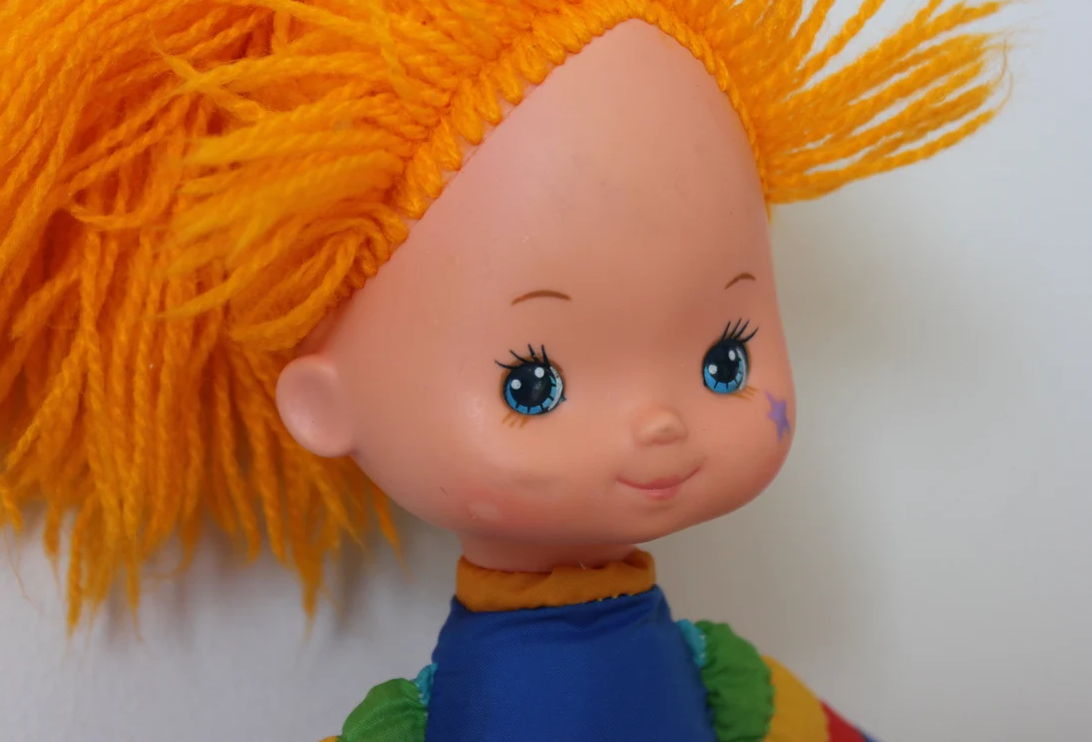 Close-up of Rainbow Brite with crayon on her face