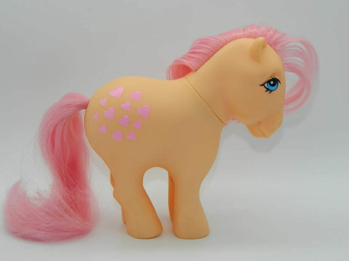 Peachy My Little Pony against a white background