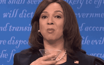 Maya Rudolph as Kamala Harris spilling liquid out of her mouth into a glass on Saturday Night Live