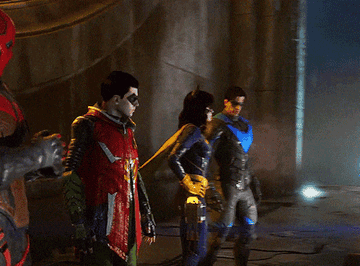 Video game Red Hood, Robin, Batwoman, and Nightwing stand together