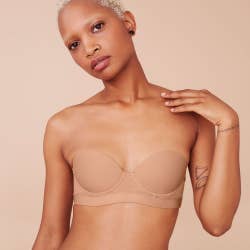 another model wearing the nude strapless bra