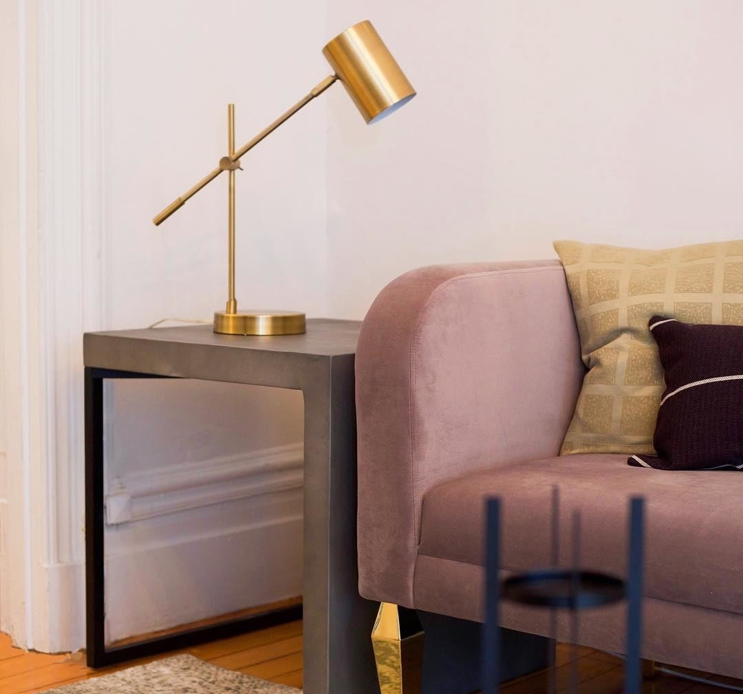 the adjustable lamp on a side table
