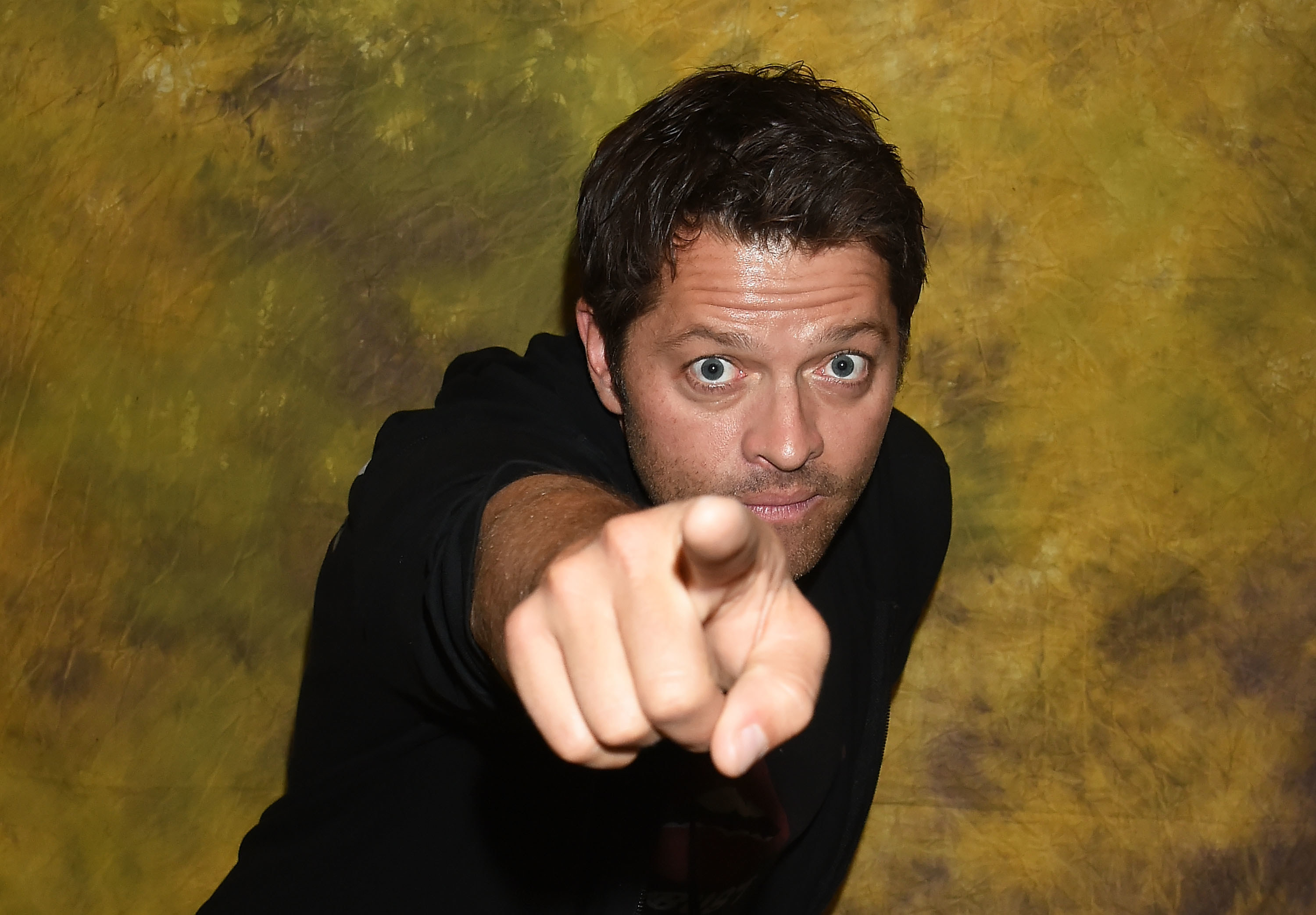 Misha Collins points at the camera