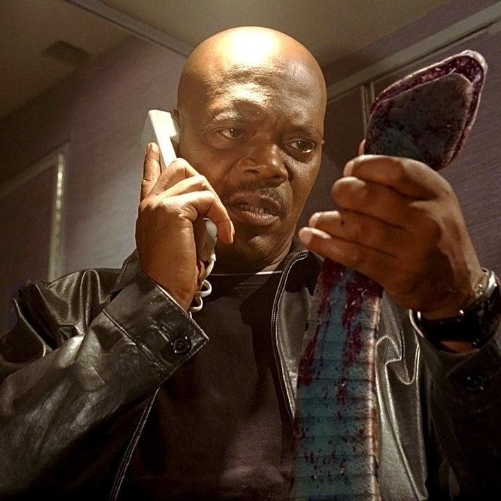 A closeup of Samuel L. Jackson holding a snake