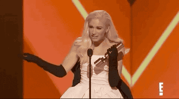 Gwen Stefani gestures to her dress while on stage and says, &quot;Icon&quot;