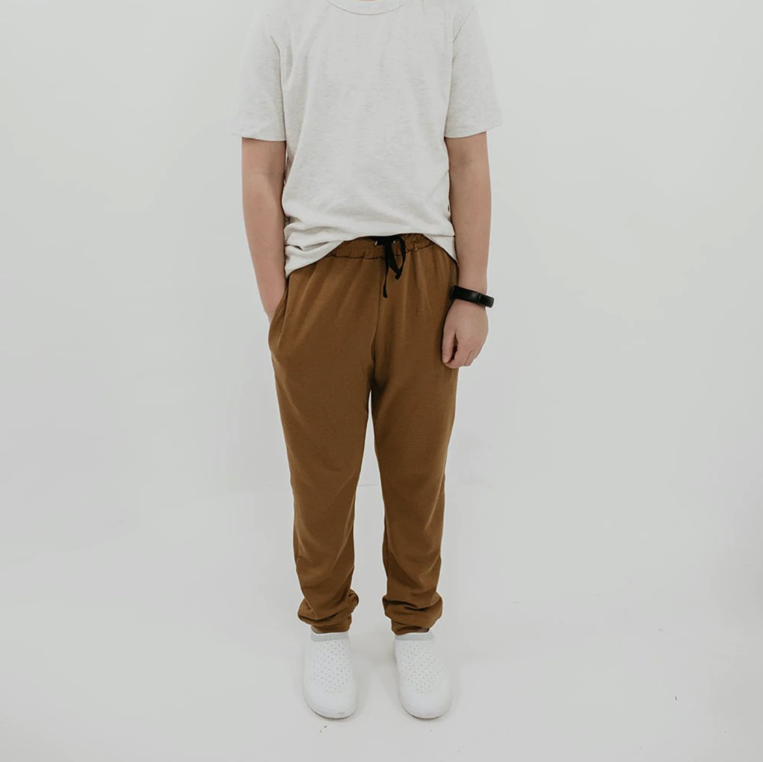 A kid wearing the joggers and a tee