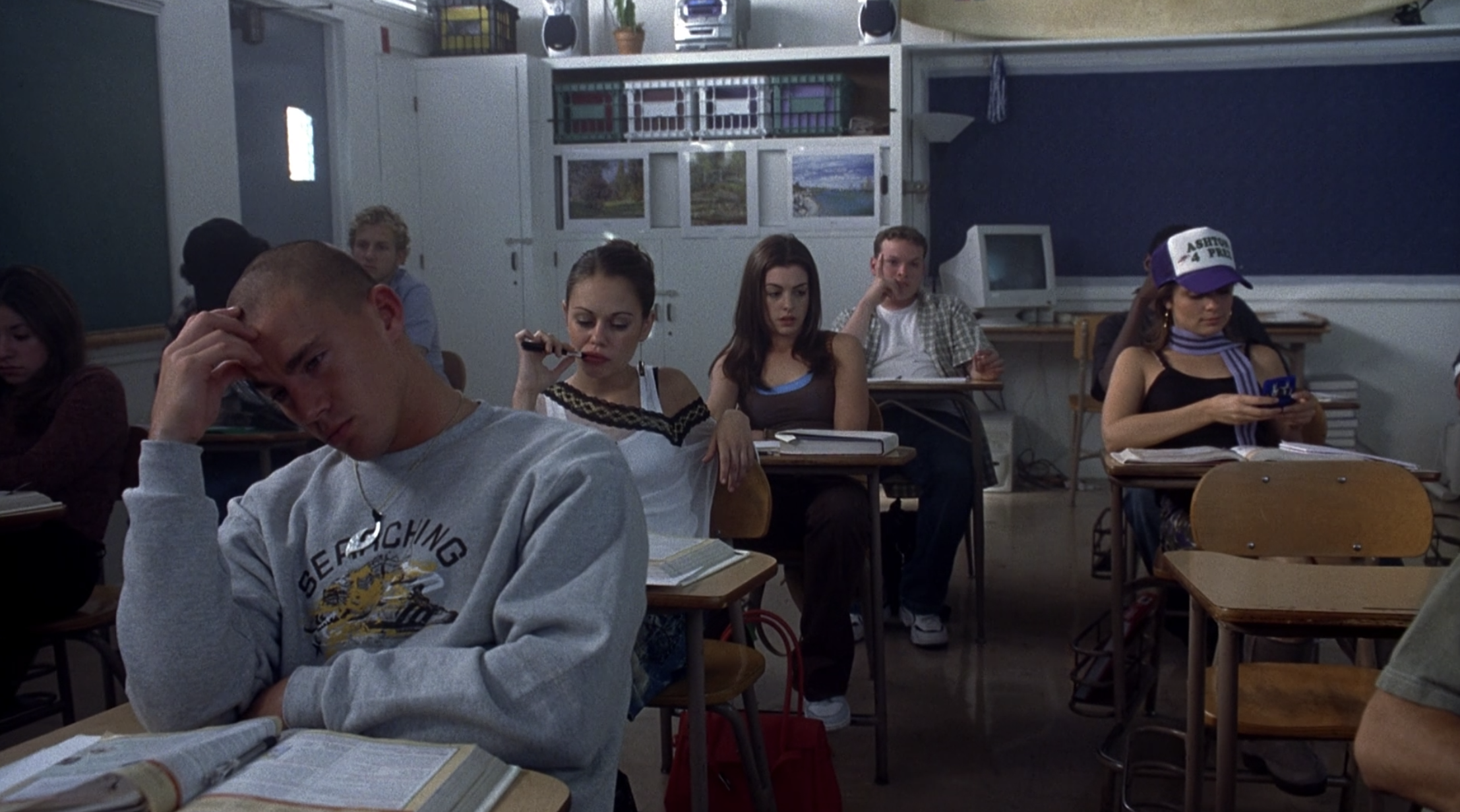 Channing Tatum, Alexis Dziena, and Anne Hathaway sitting in desks