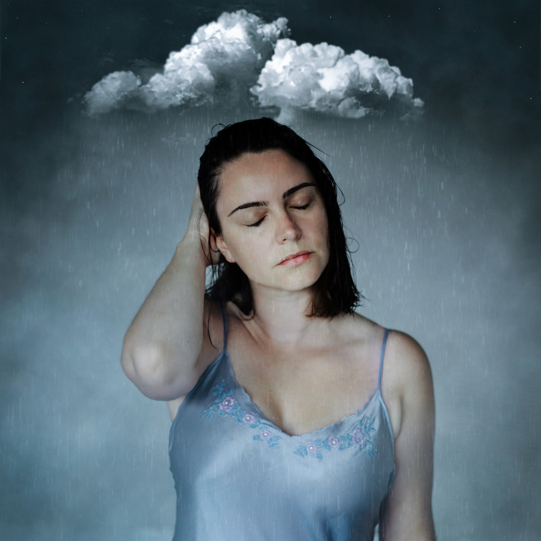 Solemn woman under a raincloud