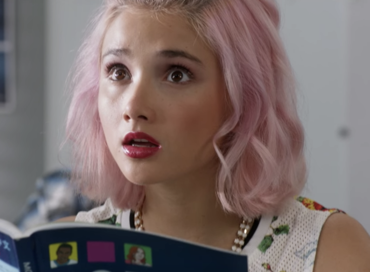 Lola from &quot;Degrassi&quot; looking surprised reading