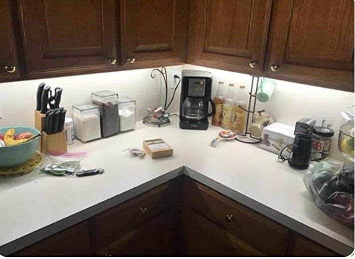 The lights installed under cabinets in a kitchen