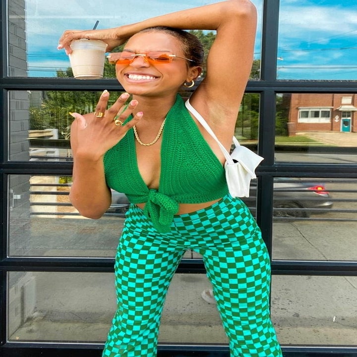 front view of a model in the green checkered pants
