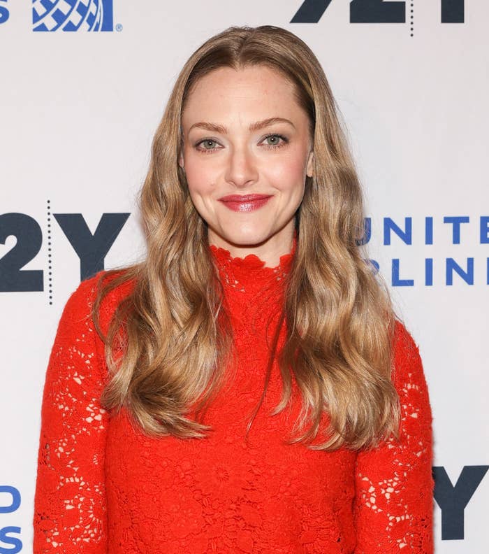Seyfried smiles at a step-and-repeat