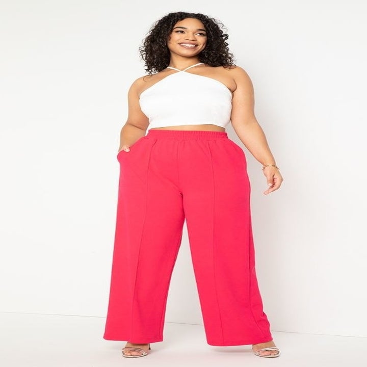 front view of a model in the pants in pink