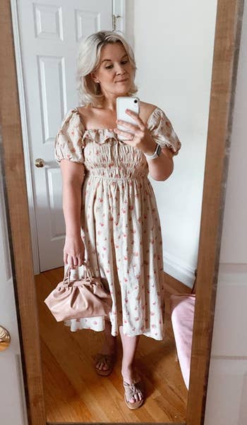 a different reviewer wearing the dress in light pink and beige