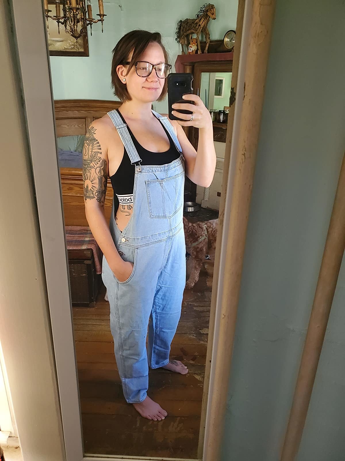 a different reviewer wearing light-wash overalls