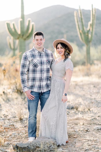 a reviewer in the long lace dress in light gray