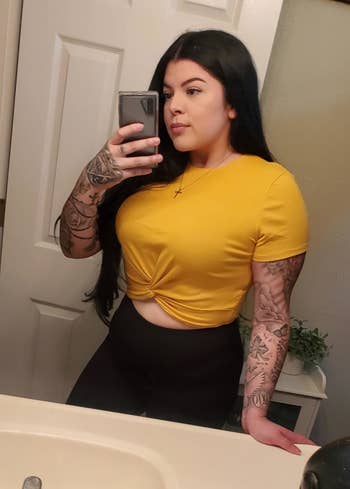reviewer wearing the top in yellow