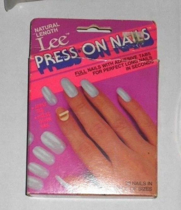 A blurry photo of a box of Lee Press-On Nails