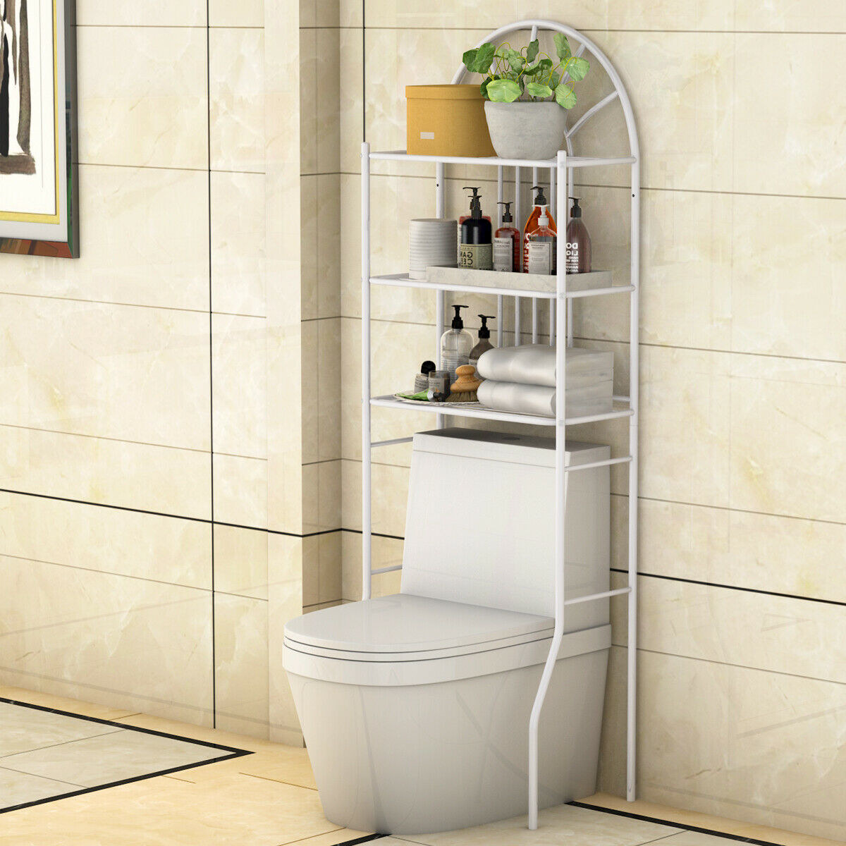 Over-the-toilet storage rack with shelves holding towels, plants, and toiletries in a bathroom