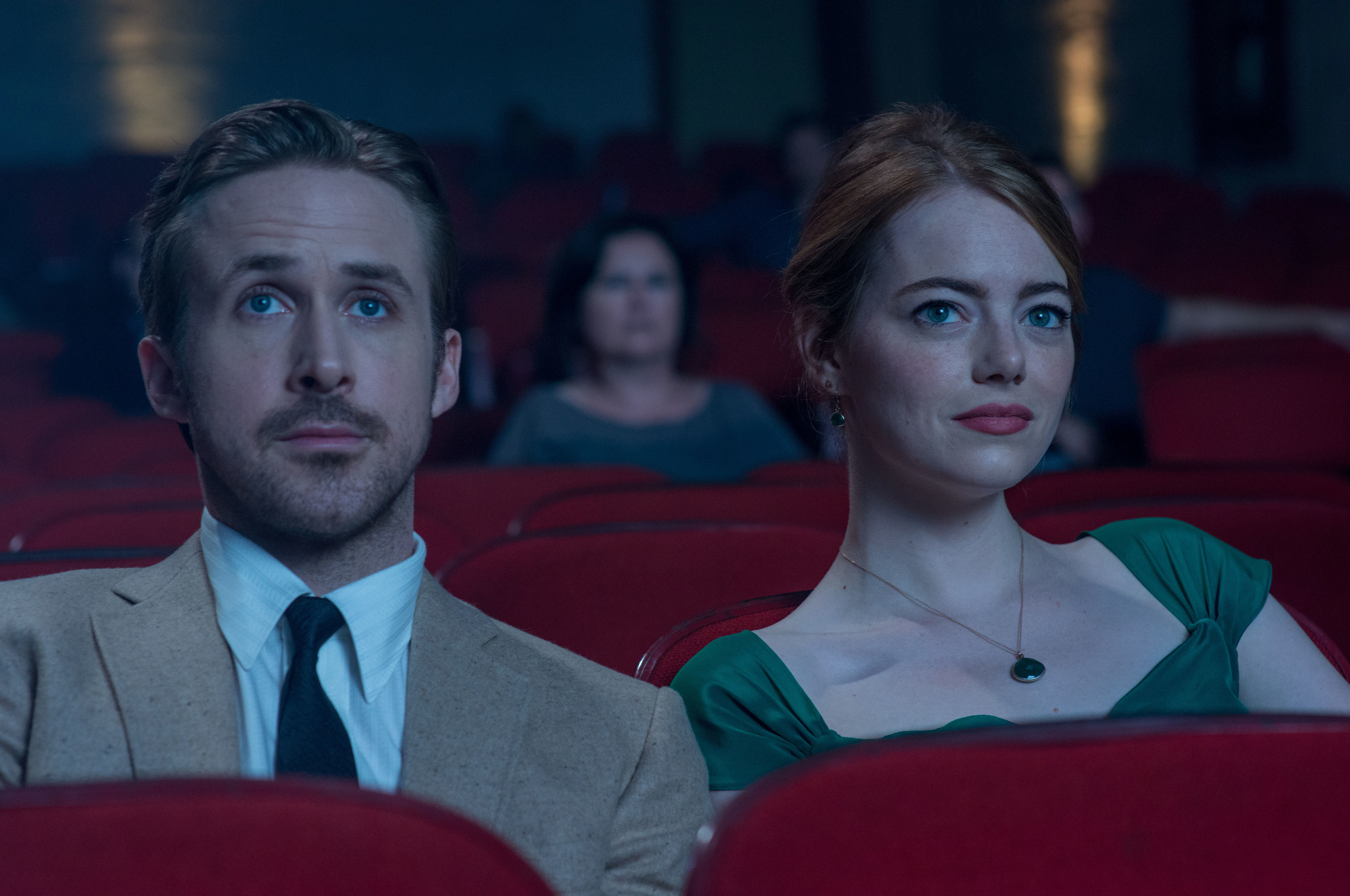 Mia and Sebastian sitting in a theatre