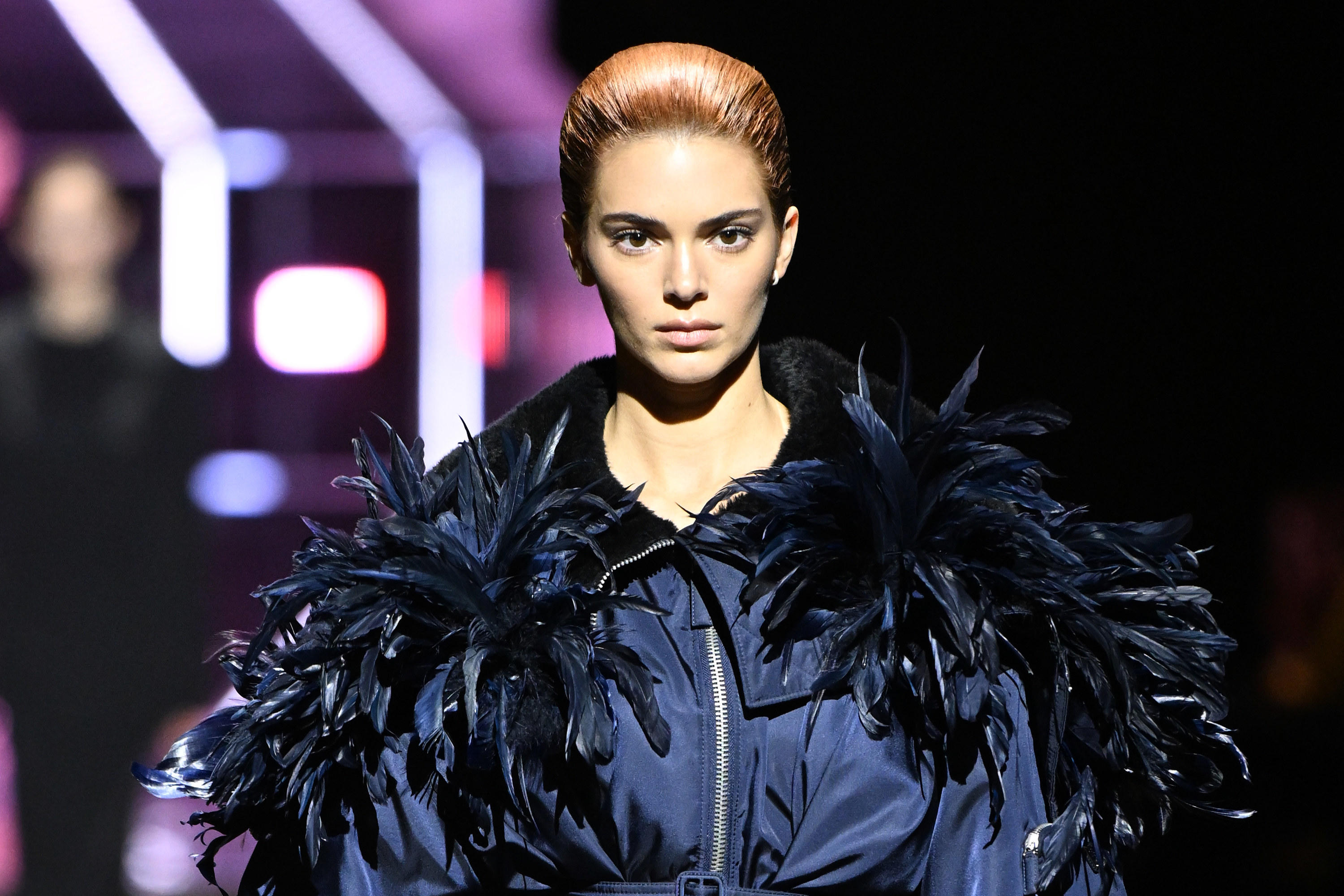 Kendall walks the runway with her red hair pulled back