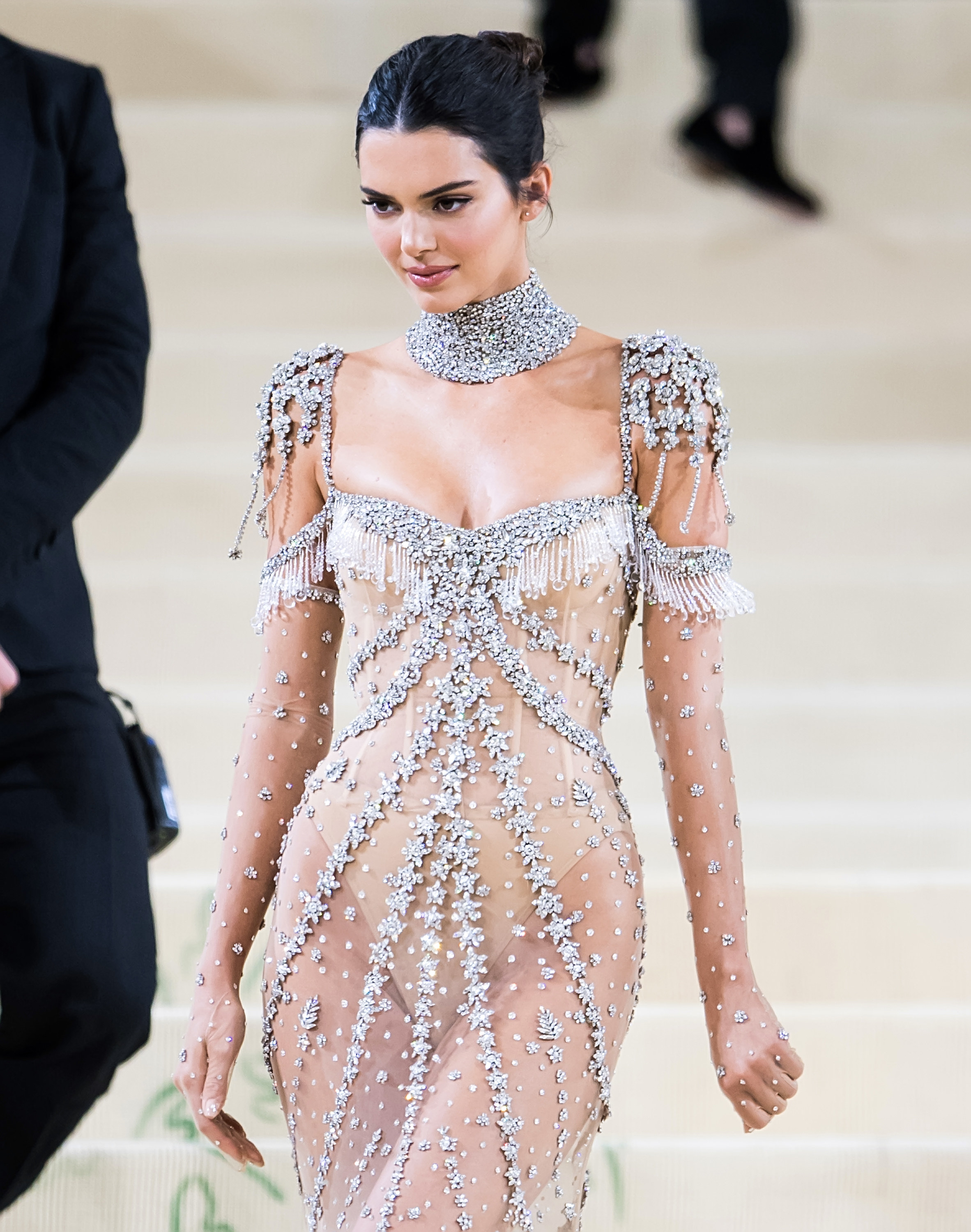 Kendall wears a sheer gown covered in diamonds with a nude bodysuit underneath