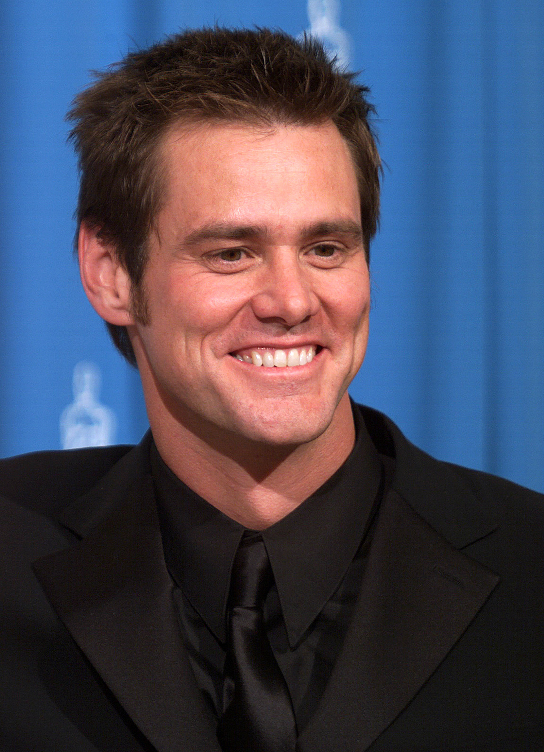 Jim Carrey smiles at an Oscar event
