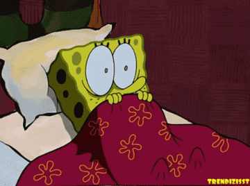 Spongebob Squarepants pulling up his blanket, scared and shivering