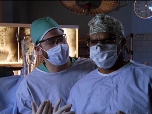 Donald Faison as Turk in Scrubs looking confused in the operating theatre