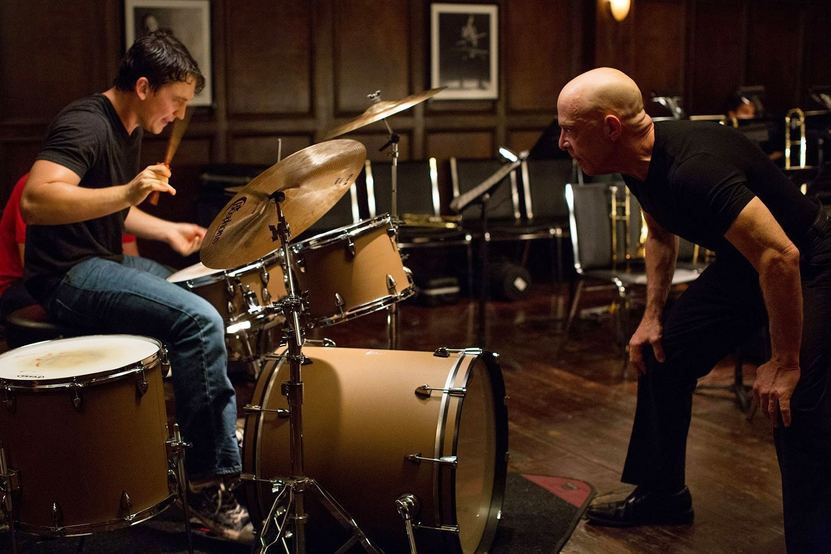 Miles Teller playing the drums as Andrew Neiman and J.K. Simmons as Terence Fletcher in Whiplash