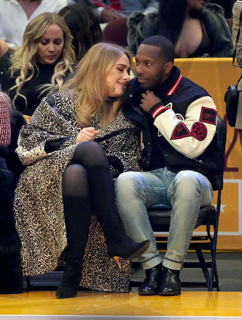 Adele and Rich Paul cuddle in their courtside seats