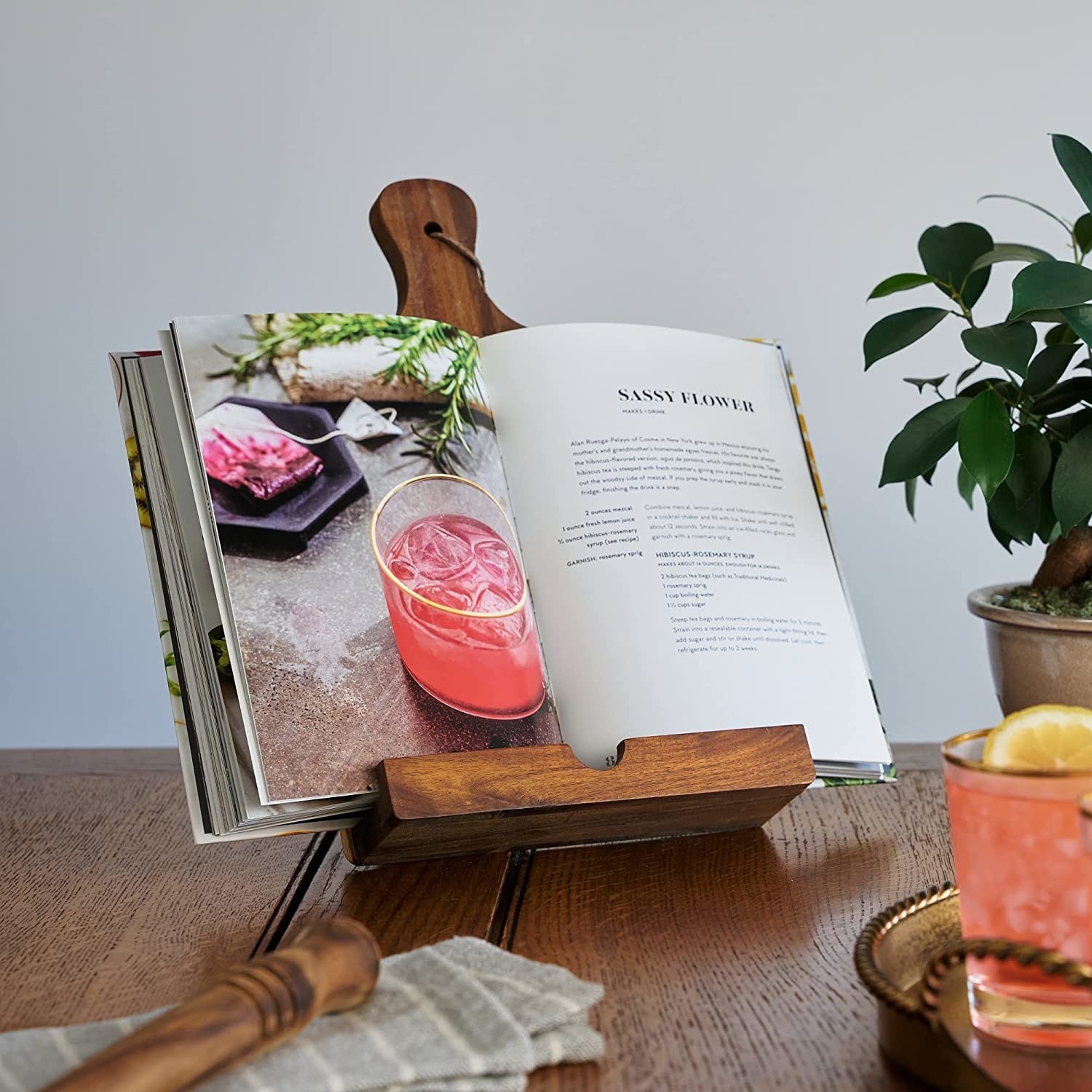 A cookbook on the book holder showing a recipe for a cocktail