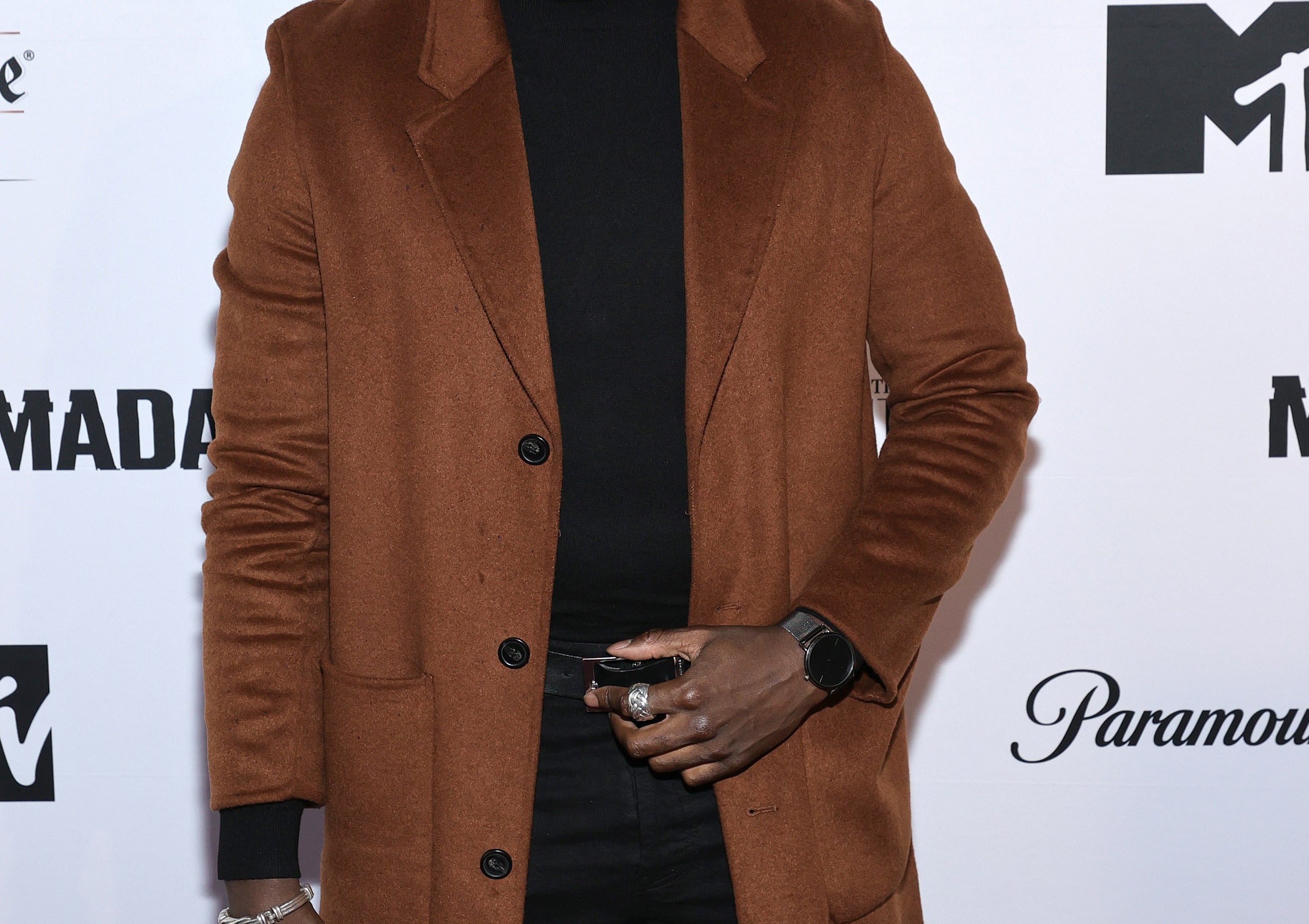 Loic Mabanza in a turtleneck and blazer