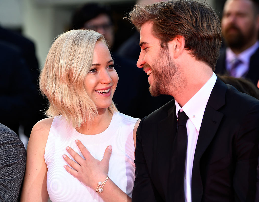 Jennifer and Liam smiling at each other